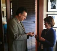 Jane Stevens receiving her Rotary Pin from Scott Wagner